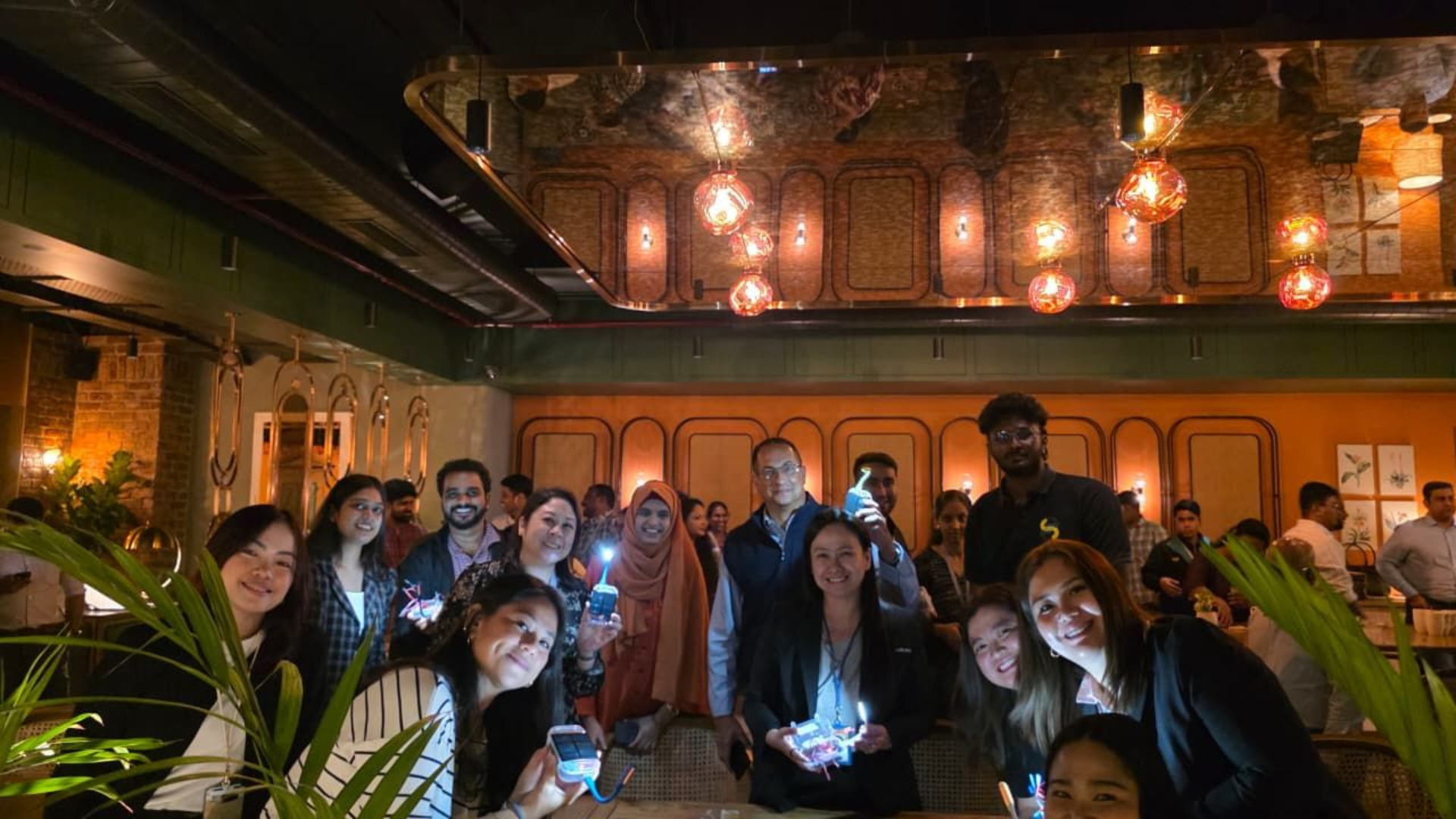 Illuminating Futures: Synchrony Volunteers Assemble Solar Lamps for Young Learners